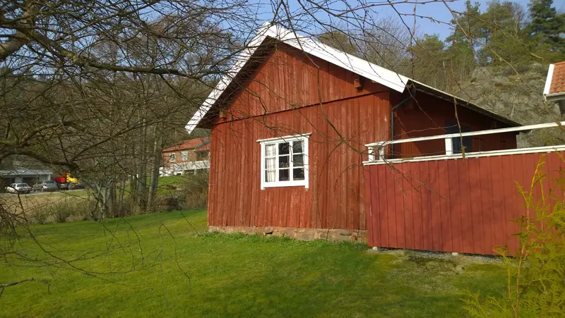 Older wood house raised on a crawl space foundation with open skirting